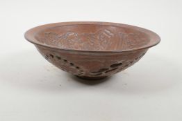 A Chinese redware bowl with reticulated lotus flower decoration to exterior and crane decoration