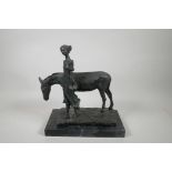 A bronze figure of a girl with an ass, 12" x 6½", 13" high