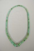 A graduated turquoise coloured hardstone bead necklace, 23" long