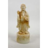 A Chinese reconstituted hardstone mould of an emperor, 8" high