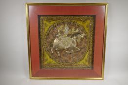 An Indian stumpwork of a figure on horseback, framed, 18½? x 18½?