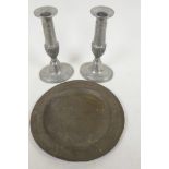 An C18th pewter plate with London touch marks, 8" diameter, together with a pair of Regency