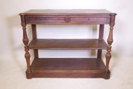 A C19th French rosewood three tier buffet, with two frieze drawers, raised on turned and carved