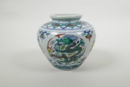 A Chinese doucai porcelain pot decoration with a dragon and flaming pearl, six character mark to