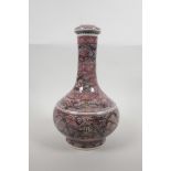 A Chinese porcelain bottle vase with red and black stylised linear kylin decoration, six character