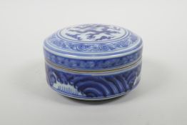 A Chinese blue and white porcelain box and cover with dragon decoration, six character mark to base,