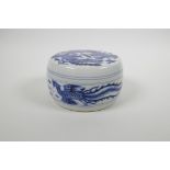 A Chinese blue and white porcelain box and cover with phoenix decoration, six character mark to