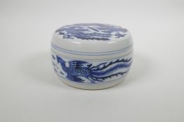 A Chinese blue and white porcelain box and cover with phoenix decoration, six character mark to