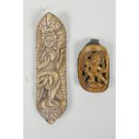 A Tibetan carved and pierced bone pendant with figural decoration in a copper setting, together with