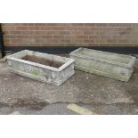 A pair of reconstituted stone garden troughs, with lion mask decoration, 37" x 17"