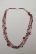 A ruby and silver gilt multi-strand necklace, 26" long