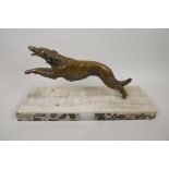 A bronze model of a hound running, mounted on a marble plinth, 10" long