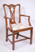 An C18th/C19th walnut Chippendale elbow chair with pierced gothic splat back, raised on square