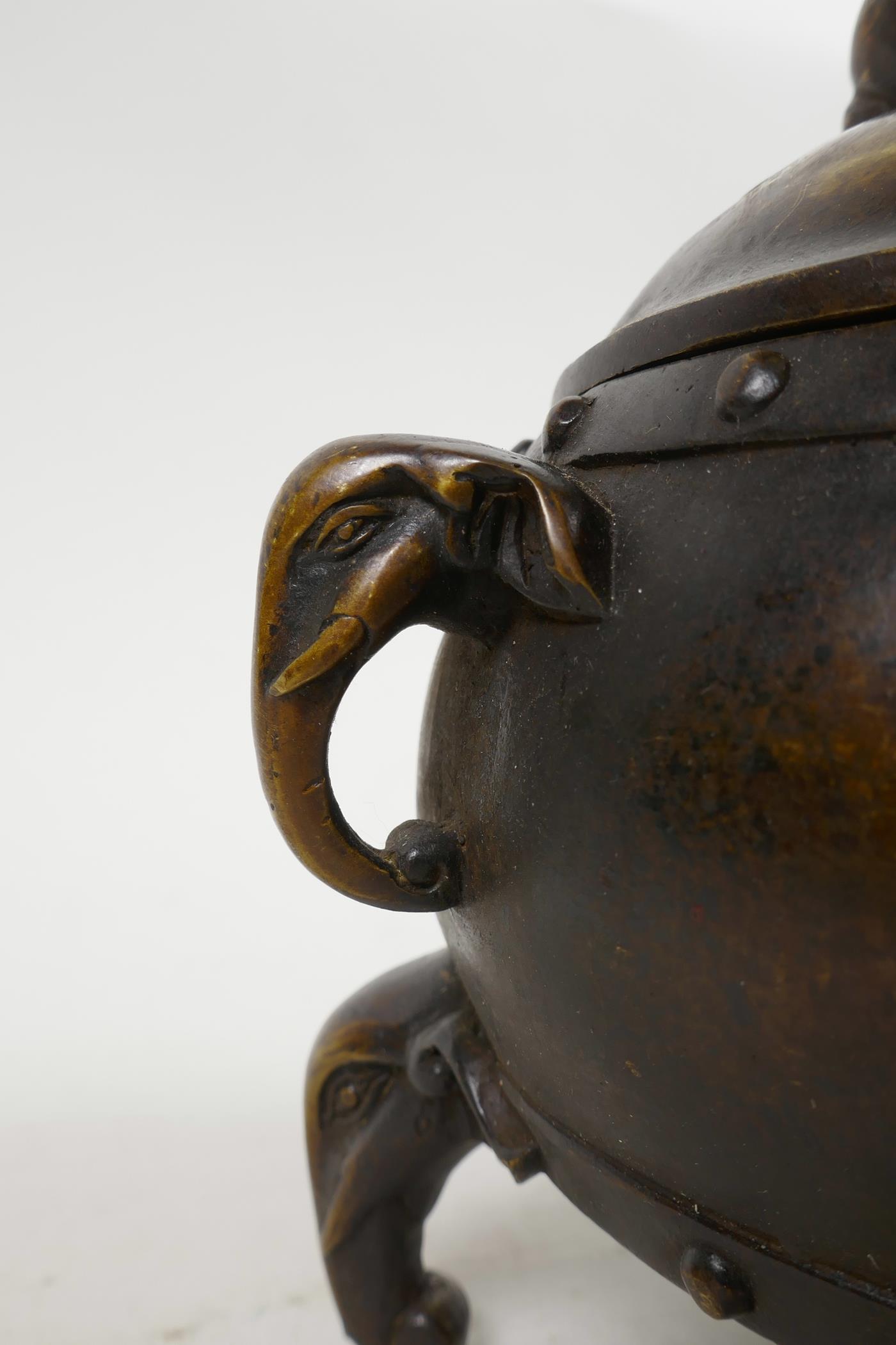A Chinese bronze barrel shaped censer with two elephant mask handles and elephant knop, raised on - Image 2 of 5