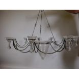 A contemporary steel eight branch chandelier with glass bowls, 42" diameter