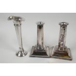 A pair of classical style Sheffield plated candlesticks with hexagonal columns on stepped square