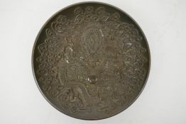 A Chinese bronze trinket dish with raised decoration of a dragon chasing the flaming pearl, 4
