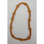 An amber style bead necklace, 24½" long