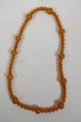 An amber style bead necklace, 24½" long