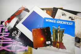 A quantity of LP vinyl records, including Wings, the Eurythmics and a 45rpm of Talking Heads (10