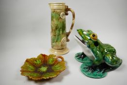 Three pieces of late C20th majolica; a leaf shaped dish, impressed mark to base, fine crack in