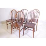 A matched set of five hoop back chairs, some with elm seats