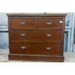 A Victorian walnut chest of two over three drawers, with reeded top and brass handles, raised on a