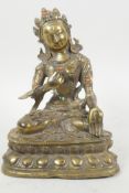 A bronze figure of Green Tara seated in meditation, studded with turquoise and coral beads, 6½" high