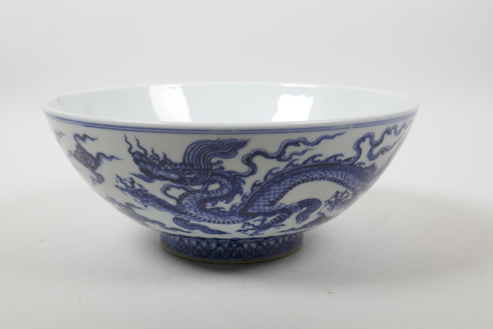 A Chinese blue and white porcelain bowl decorated with two dragons, 6 character mark to lip, 9" - Image 3 of 6