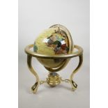 A brass and composition terrestrial globe, the countries set with semi-precious stones, 12"