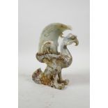 A Chinese carved jade phoenix shaped brush holder, 8½" high