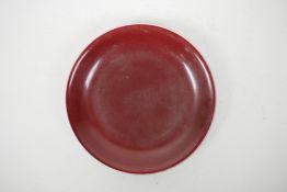 A Chinese sang de boeuf glazed porcelain dish, 6 character mark to base, 7" diameter