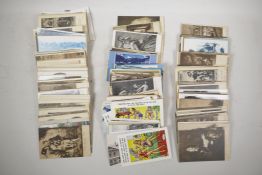A quantity of early C20th postcards, topographical and saucy, approximately 500