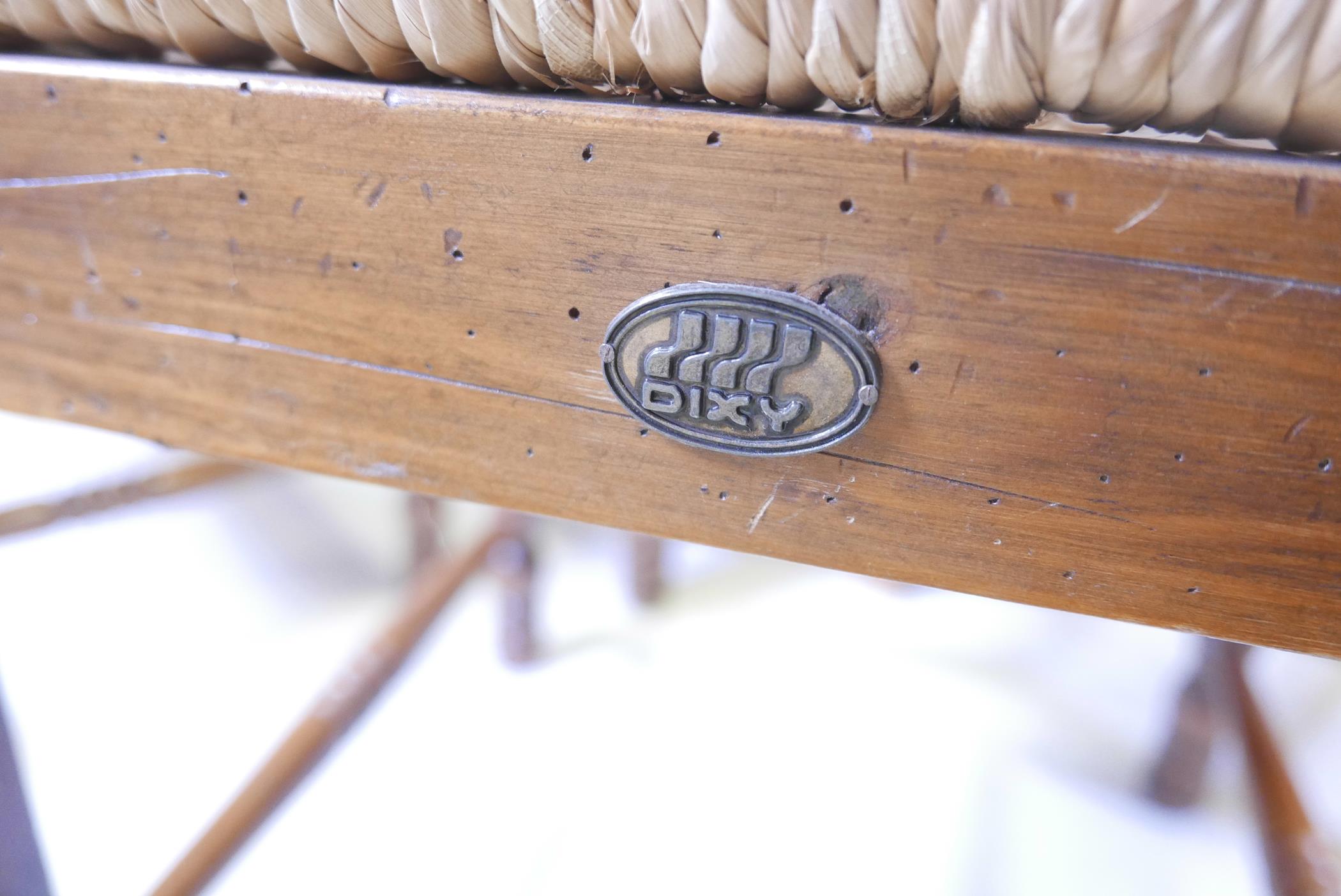 A set of eight rush seated fruitwood chairs with applied Dixy maker's plaque - Image 3 of 3