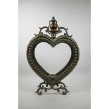 A coppered and pierced metal heart shaped lantern, 20" x 14"