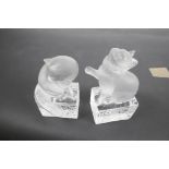 A pair of Lalique frosted and clear glass bookends, modelled as cats, signed and dated Christmas