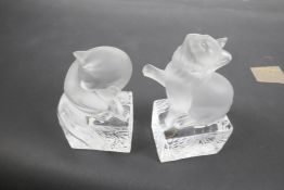 A pair of Lalique frosted and clear glass bookends, modelled as cats, signed and dated Christmas