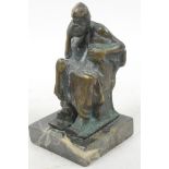 A stylised bronze figure of a seated, bearded man in Greek robes resting his head on his hand in a