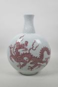 A Chinese red and white porcelain moon flask with dragon decoration, 6 character mark to base,