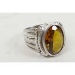 A 925 silver ring set with faceted green (citrine) stone, size 'V'