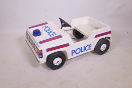 A child's pedal police car, A/F, 33" x 18"