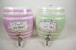 A pair of porcelain barrel decanters with brass taps marked 'iced tea' and 'lemonade', 10½" high,