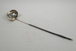 A Georgian hallmarked silver punch ladle with a whale bone handle, London 1802, 15" long