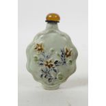 A Chinese Sancai porcelain snuff bottle with floral decoration, 4" high