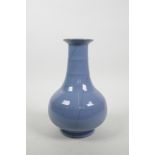 A Chinese blue ground crackleware vase with a ribbed neck, 9" high