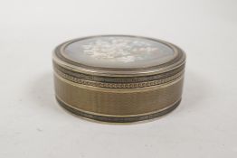 A French silver gilt box, the cover with an inset miniature watercolour still life of flowers,