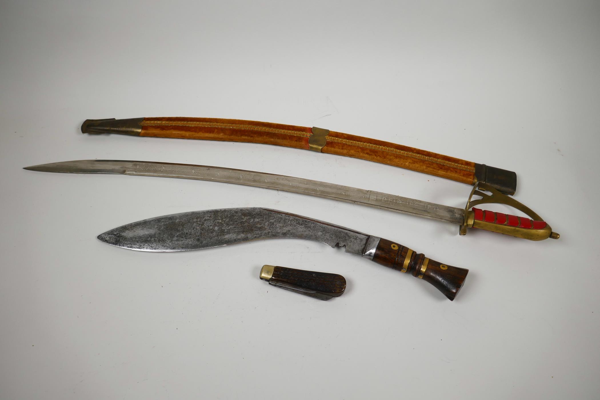 An Oriental Indian sword in velvet covered scabbard, 27½" long together with a wood and brass - Image 3 of 5
