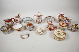 A quantity of Japanese Kutani porcelain including Kyusu teapots, jugs, vases, saucers etc, largest