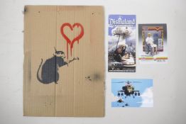 After Banksy, a collection of ephemera from Dismaland including a stencilled corrugated card placard