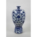A Chinese blue and white Ming style vase with scrolling lotus flower decoration, 11½" high